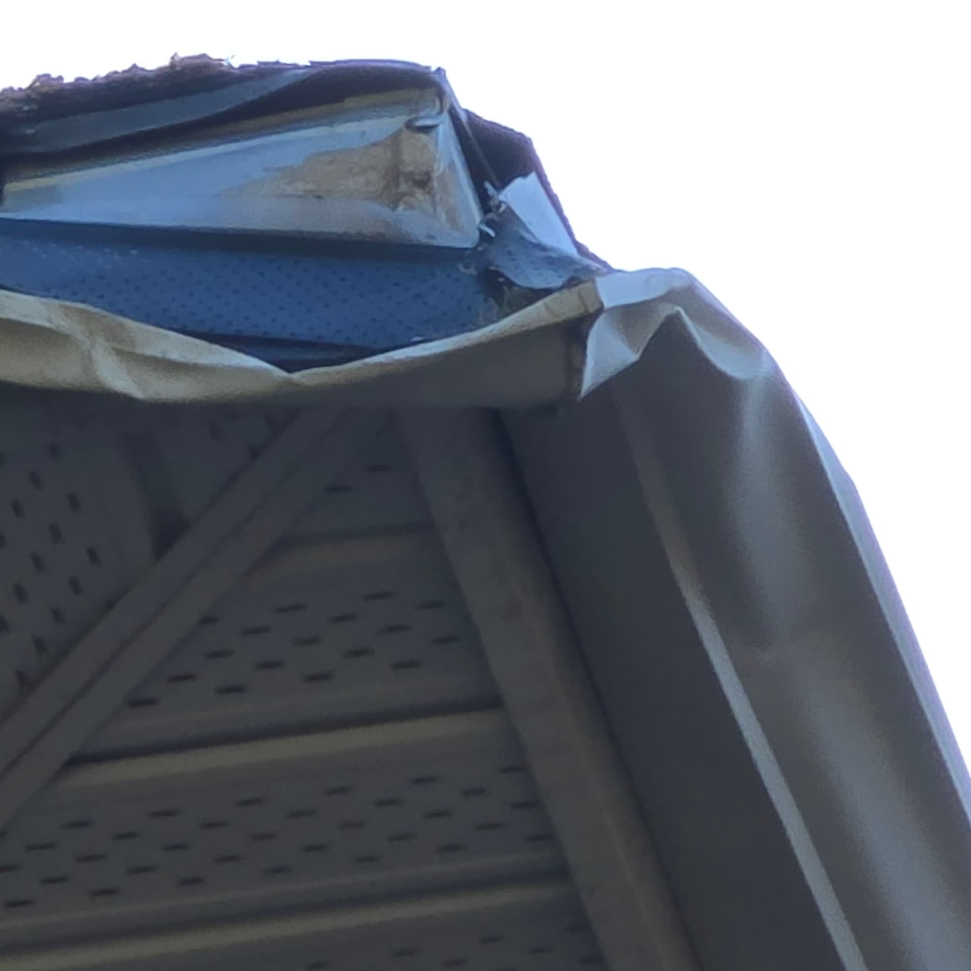 Calgary eavestrough damage after wind and tree impact