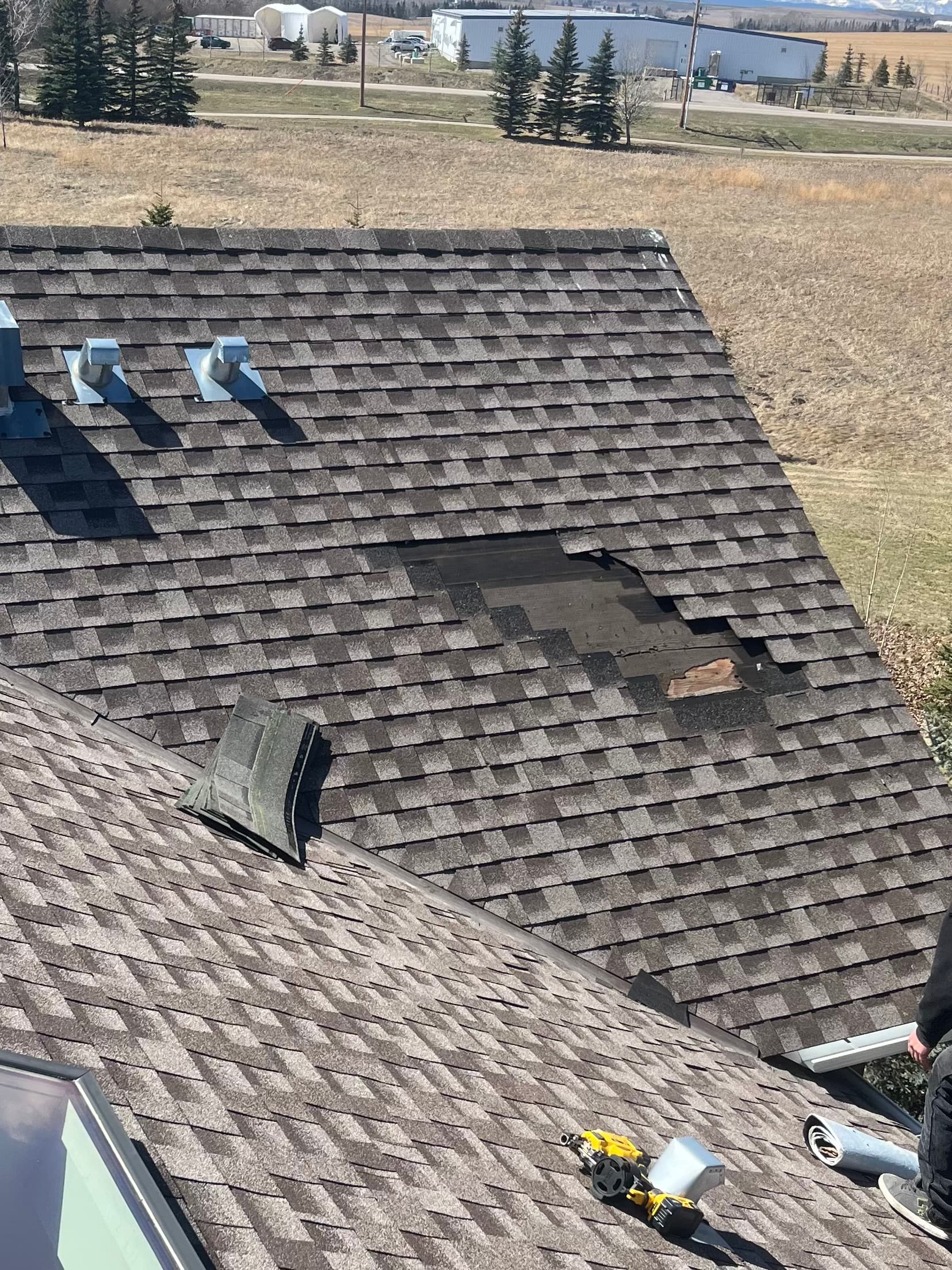 Calgary roof slope with wind damage