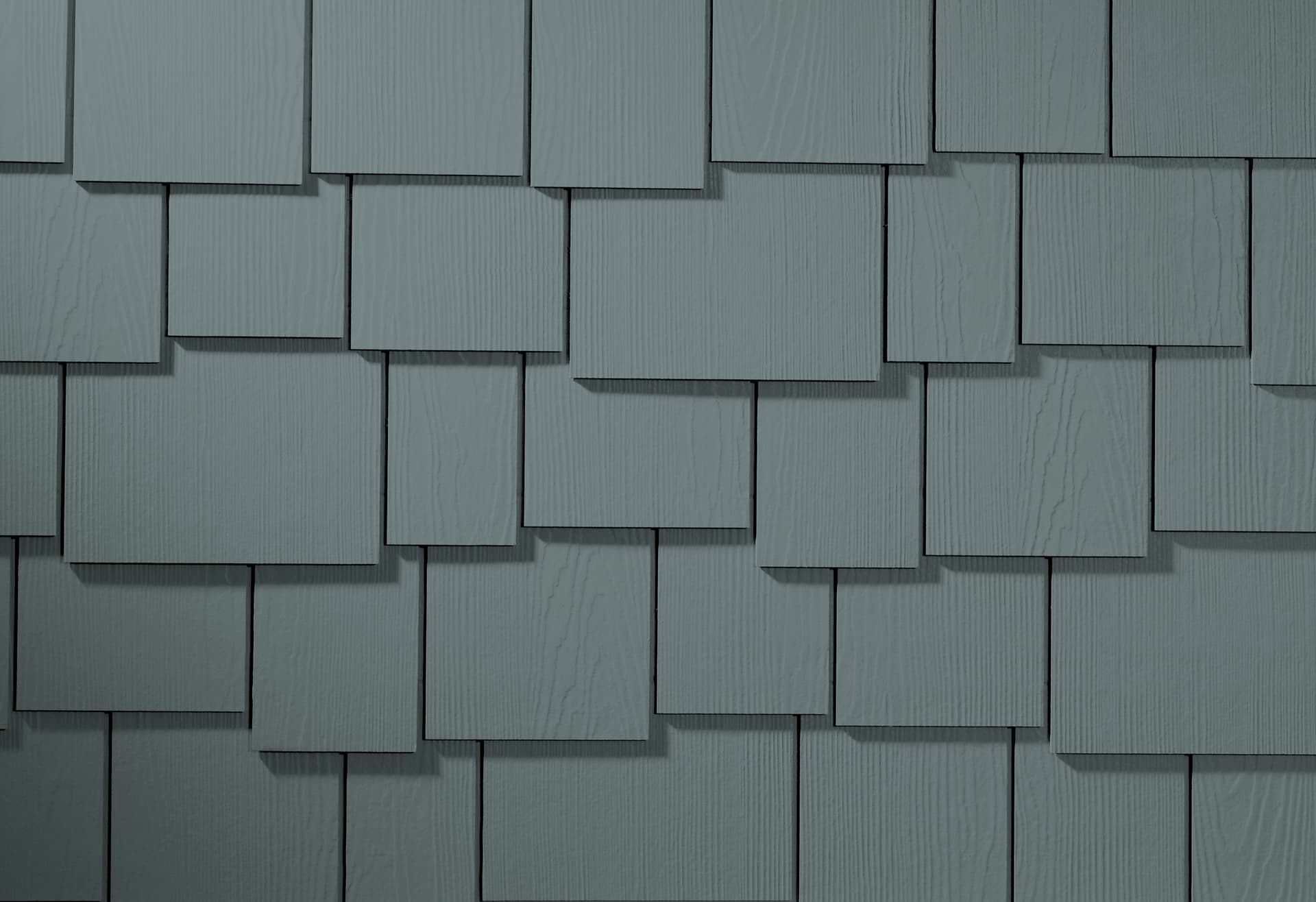 Manufacturer-supplied staggered Hardie Shingle siding in Boothbay Blue